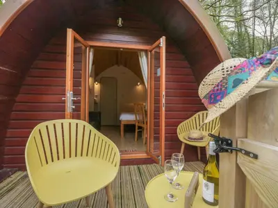 a small cabin with two chairs and a table at Pod No 6 in Keswick