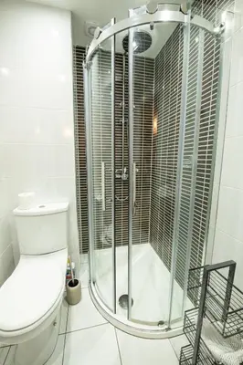 a bathroom with a toilet and a glass shower at 25 Church Street in Keswick