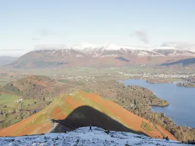 a person standing on top of a mountain overlooking a lake at Briery House in Keswick