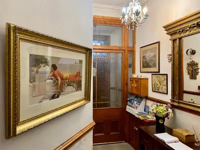 a room with a picture of a woman on the wall at Elm Tree Lodge in Keswick