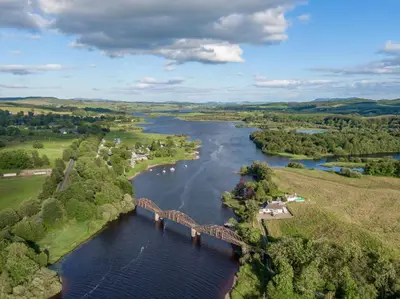an aerial view of a bridge over a river at Airds of Kells House in Castle Douglas