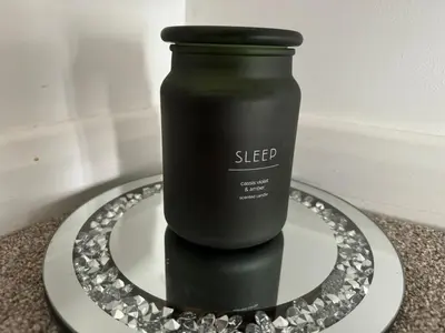 a black bottle on a plate on a table at Scotch Terrace - 3 Bedrooms - Sleeps 6 in Whitehaven