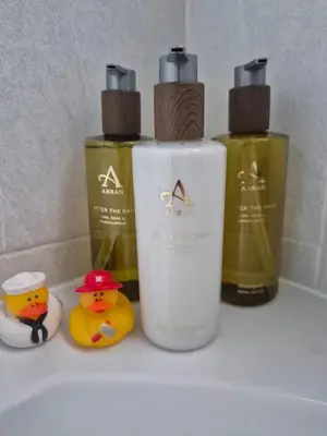 a group of three bottles of soap and rubber ducks at Links Golf Villa in Troon