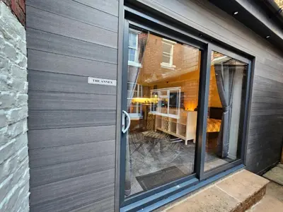 a door with a sign that reads the room at Carlisle City Centre The Wash House in Carlisle