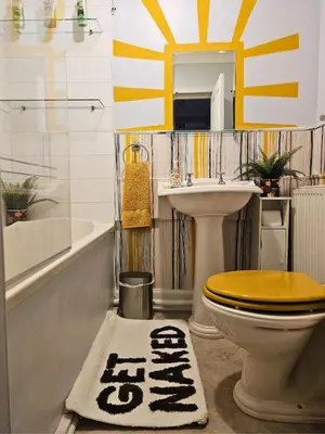 a bathroom with a toilet and a sink at The Ferns - Modern Apartment With Parking & Shared Garden in Darvel