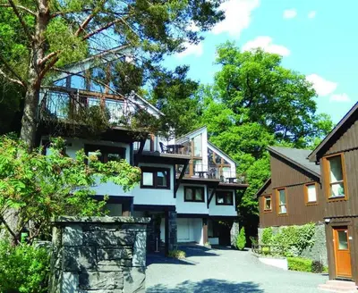a house with a balcony on the side of it at Keswick Bridge 6, within walking distance of Keswick town centre, strictly no pets in Keswick