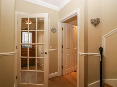 a hallway with a door to a room at Castle Crag in Keswick