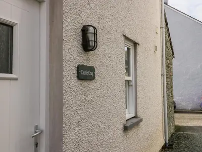 a sign on the side of a building with a window at Castle Crag in Keswick