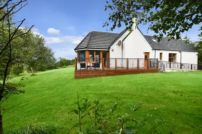 a house with a large green lawn in front of it at North Blairkip Eildon in Sorn