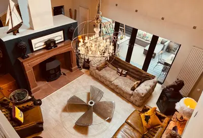 an overhead view of a living room with a chandelier at Bonshaw Grange-Riverside Country Retreat, & HotTub in Lockerbie