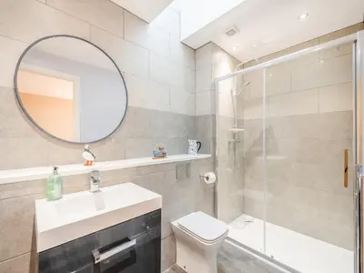 a bathroom with a sink toilet and a mirror at The Byre - Uk45343 in Ayr