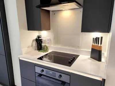 a kitchen with a sink and a stove top oven at Carvetii - ANNE House Room 1 - Dbl bed Ground floor en-suite in Carlisle