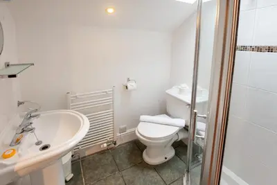 a bathroom with a toilet and a sink and a shower at Spedding Fold Chapel Stile in Chapel Stile
