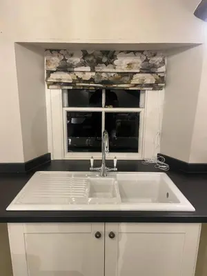 a kitchen with a sink and a window at Penthouse apartment in Cockermouth