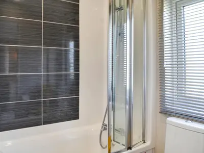 a bathroom with a shower and a toilet at Gill Bay - Uk45513 in Mainsriddle