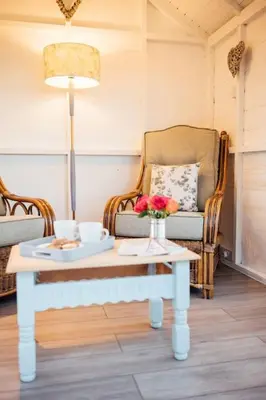 a living room with a coffee table and a couch at The Dairy Bothy at Clauchan Holiday Cottages in Gatehouse of Fleet