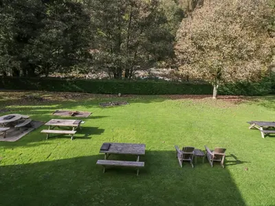 a group of picnic tables and chairs in a park at Apartment 4 in Keswick