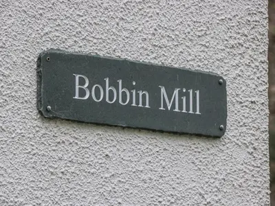 a sign on a wall that reads bolbin mill at Apartment 6 in Keswick
