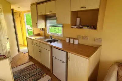 a kitchen with a sink and a counter top at Tarn Bay Retreat- Sea- Fells- Beach- Views-Farm in Millom