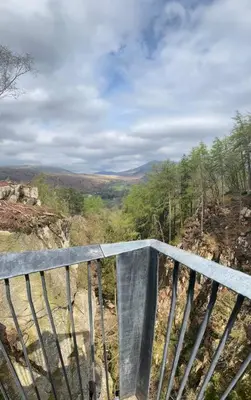 a balcony with a view of a mountain at Hillside Cottage Eskdale Green in Beckfoot