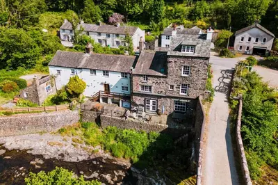 an aerial view of a large stone house at Bridge Cottage Keswick in Keswick