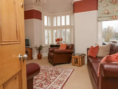 a living room with a couch and a chair at Heatherlea in Keswick