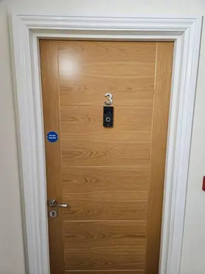 a wooden door with a lock in a room at Carlisle City Centre. Spacious Apartment. Ideal location. in Carlisle