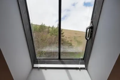 a window in a room with a view of a field at 2 Bed in Threlkeld SZ134 in Threlkeld