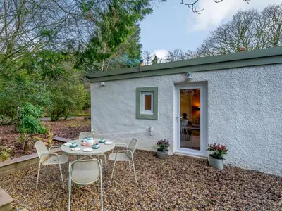 a patio with a table and chairs in front of a building at 2 Bed in Cockermouth 86528 in Arlecdon