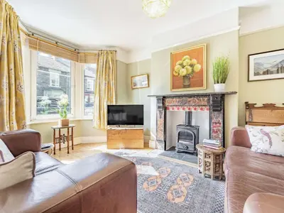a living room with a couch and a fireplace at 2 bed in Keswick 87732 in Keswick