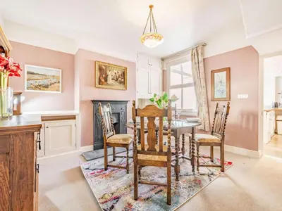 a kitchen with a table and chairs and a fireplace at 2 bed in Keswick 87732 in Keswick