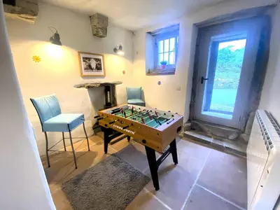 a room with a foosball table and two chairs at 2 Bed in High Lorton 86023 in Lorton