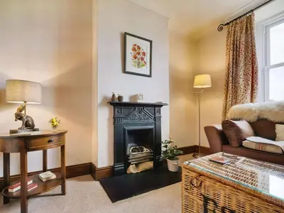 a living room with a fireplace and a couch at 3 Bed in Ennerdale Bridge SZ392 in Ennerdale Bridge