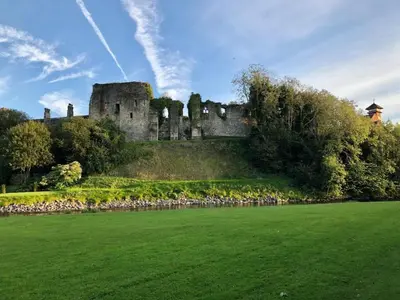 a castle on a hill with a green field at 2 Bed in Cockermouth oc-87481 in Cockermouth