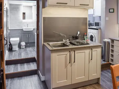 a small kitchen with a sink and a sink at Lingmoor View in Ambleside