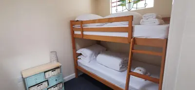 a bunk bed room with two bunk beds at The Wee Hoose in Dumfries