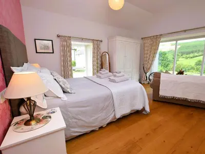 a bedroom with a bed with white sheets and a window at 4 Bed in Moffat 82374 in Moffat