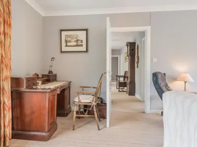 a room with a bed and a desk and chairs at 3 Bed in Portinscale SZ528 in Portinscale