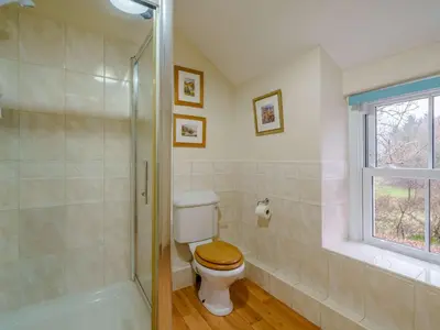 a bathroom with a toilet and a shower at 1 bed property in Keswick 86117 in Braithwaite