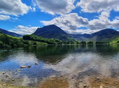 a body of water with mountains in the background at 2 Bed in Rosthwaite 86397 in Rosthwaite