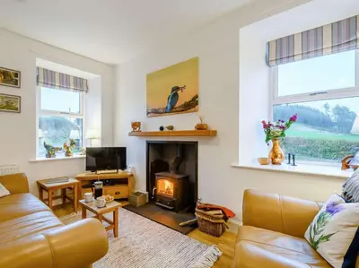 a living room with a couch and a fireplace at 3 Bed in Lockerbie 89406 in Lockerbie
