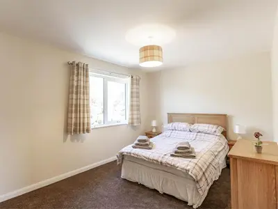 a bedroom with a bed and a window at 3 Bed in Moffat oc-ca402 in Moffat