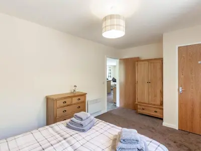 a bedroom with a bed with towels on it at 3 Bed in Moffat oc-ca402 in Moffat