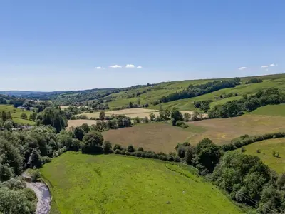 an aerial view of the rolling green hills and trees at 3 Bed in Moffat oc-ca402 in Moffat