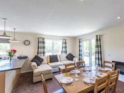 a living room with a table and a couch at 3 Bed in Moffat oc-ca402 in Moffat