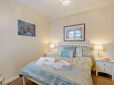 a bedroom with a bed with towels on it at 2 Bed in Keswick 80515 in Keswick