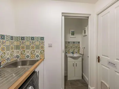 a small kitchen with a sink and a sink at 4 Bed in Keswick oc-87567 in Keswick