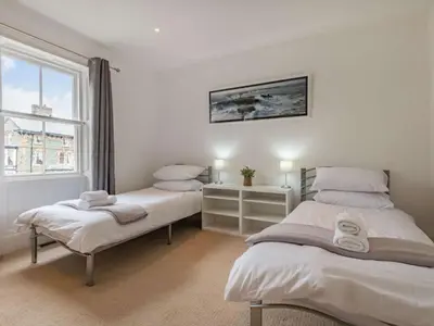 a bedroom with two beds and a window at 4 Bed in Keswick oc-87567 in Keswick