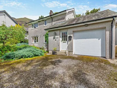a house with a garage and a driveway at 3 Bed in Threlkeld SZ047 in Threlkeld
