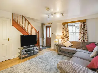 a living room with a couch and a flat screen tv at 2 bed in Keswick SZ062 in Keswick